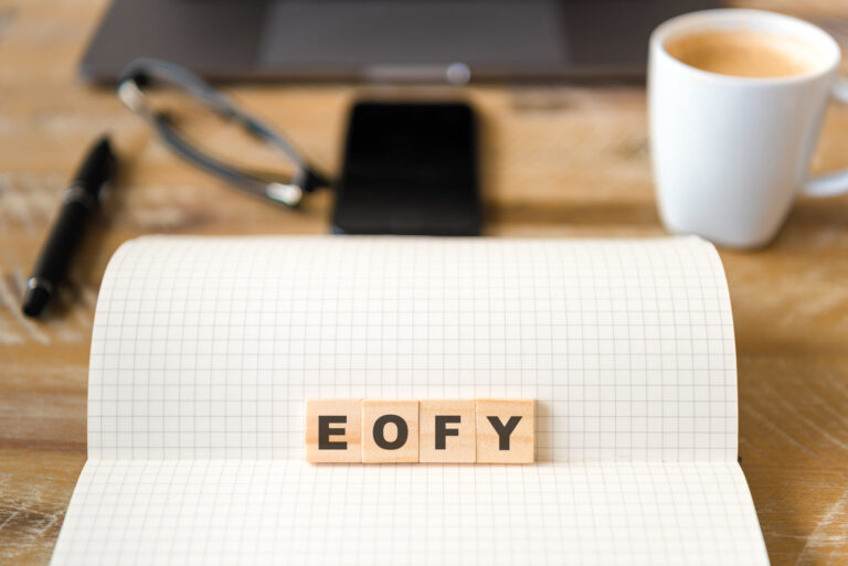 Closeup,On,Notebook,Over,Desk,Background,,Focus,On,Wooden,Blocks